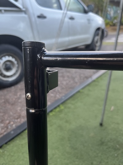 Screw fitted through the top of a bunk frame side pole to stiffen the joint