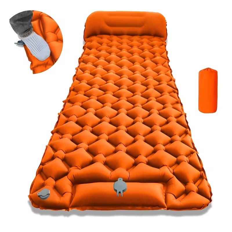 Orange inflatable camping sleeping pad with built-in pump