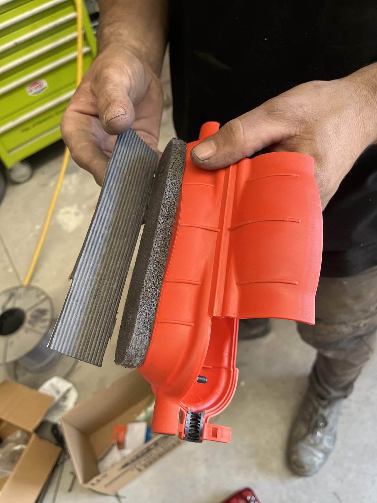 Air filter housing from alternate angle showing louvred outer shell for airflow