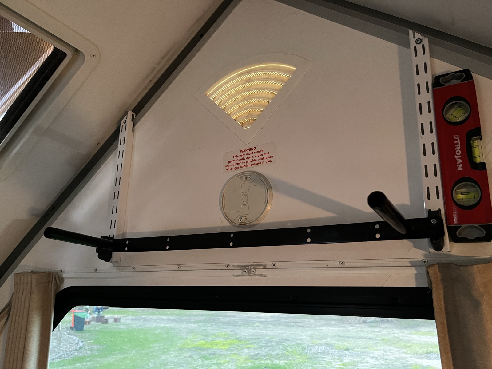 Floating oak shelf mounted on the apex wall of an Avan Cruiseliner