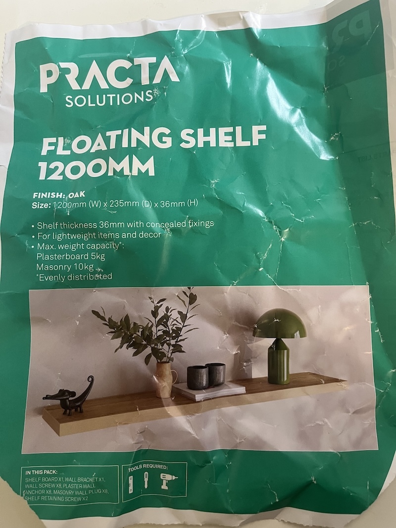 Practa floating shelf packaging listing the 36mm shelf thickness and oak finish
